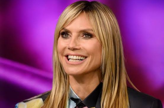 Heidi Klum flaunts bare boobs as she vacations with husband and daughter